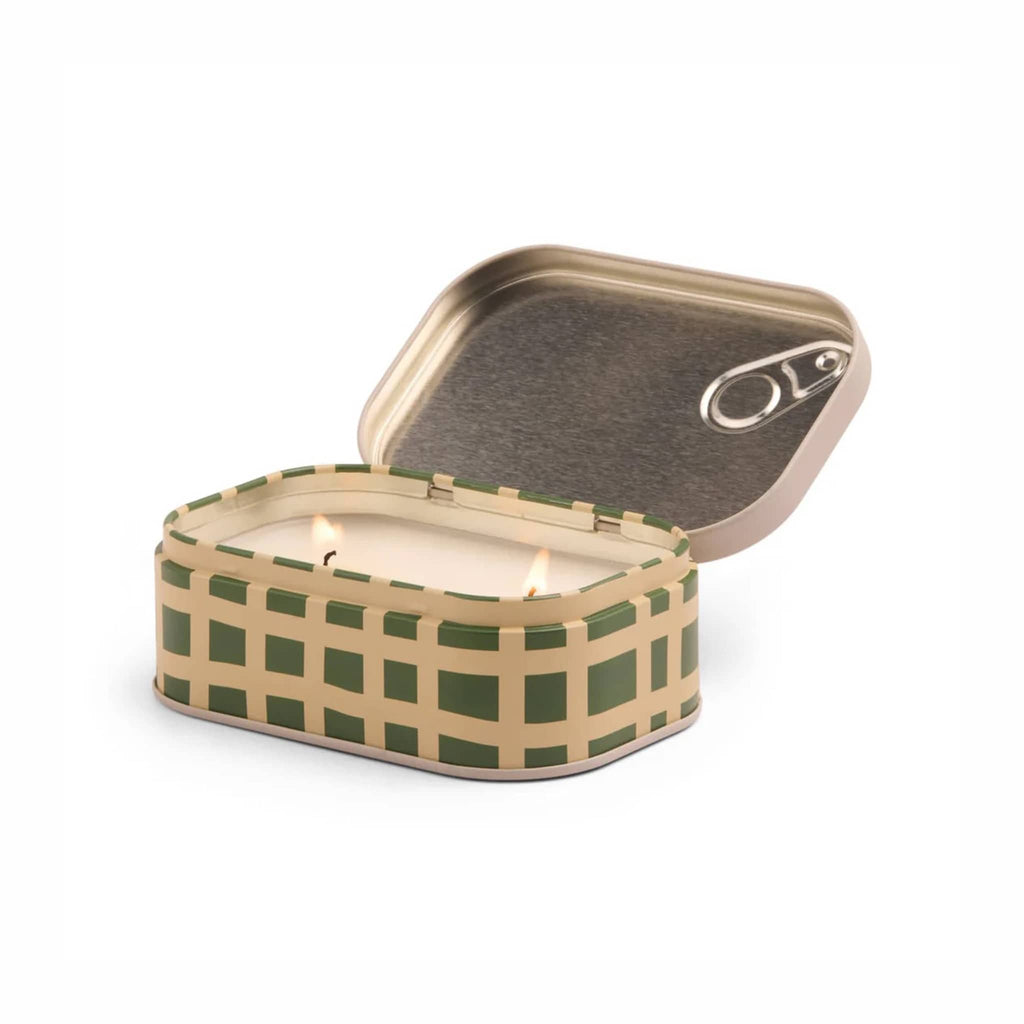 Scented candle in a checkered tin with a lid and 2 lit wicks on a white background.