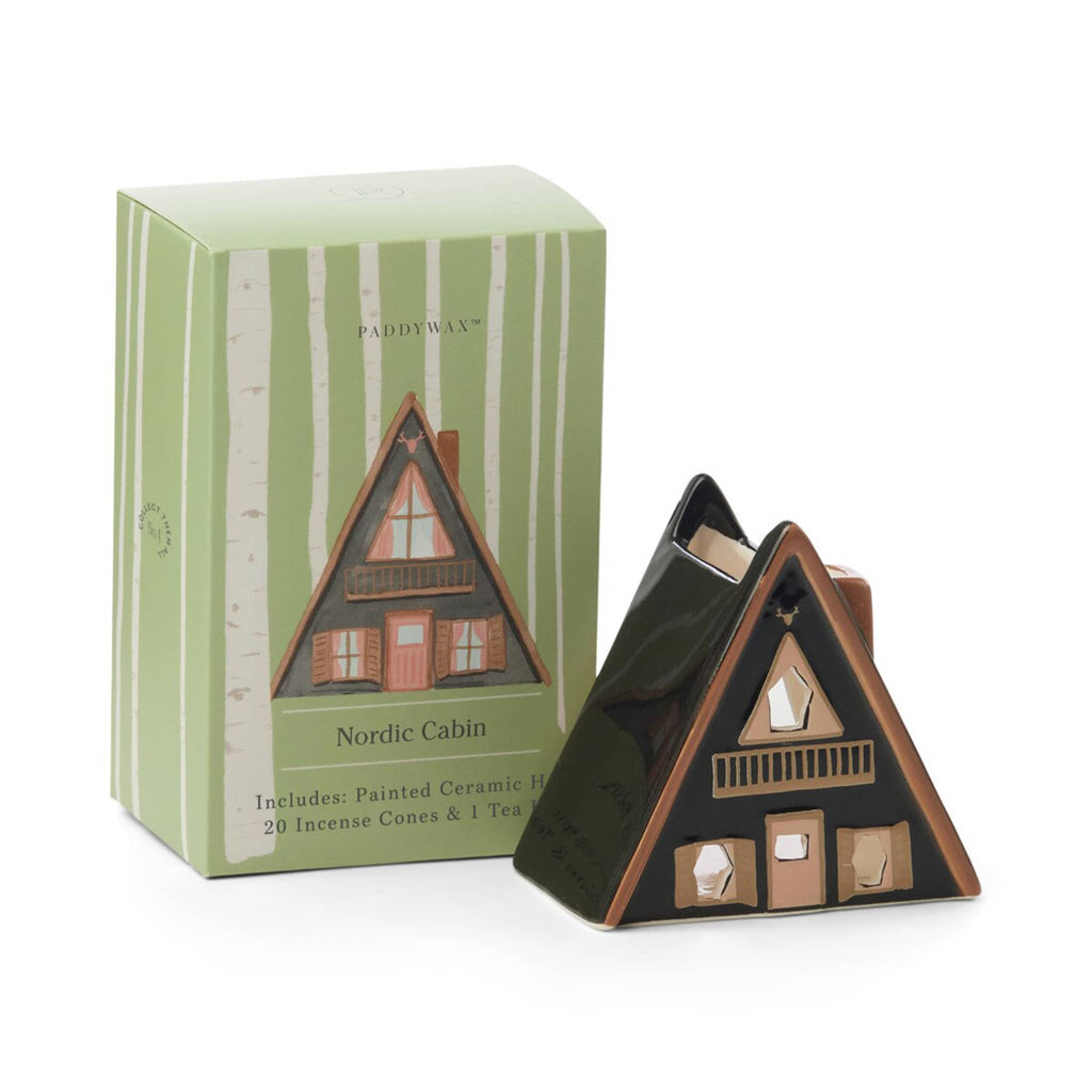 Nordic cabin-shaped ceramic incense and tea light holder with green packaging on a white background.