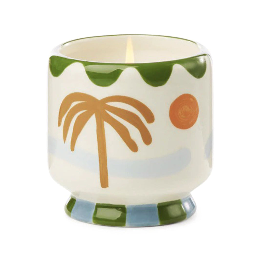 Paddywax A Dopo 8 ounce Lush Palms scented candle in a ceramic vessel hand painted with a palm tree design.