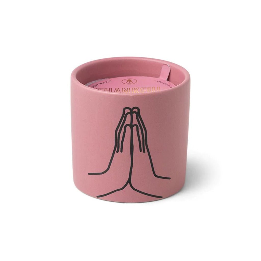 paddywax impressions 5.75 ounce hands clasped thankful for you violet vanilla scented soy wax candle in matte mauve ceramic vessel.