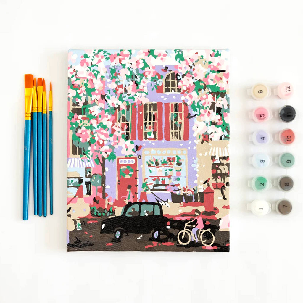 Paint Anywhere Periwinkle Blossom Street 8 by 10 inch canvas paint by number kit, brushes and paint pots with finished painting.