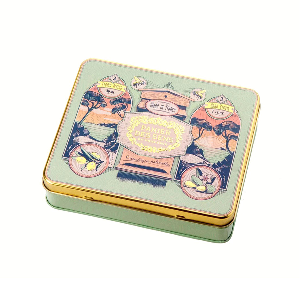 Panier Des Sens Timeless Hand Cream Trio in illustrated green tin, lid closed.