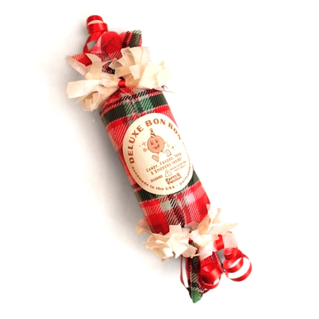 Christmas surprise bon bon favor with plaid wrapping and bow on a white background.