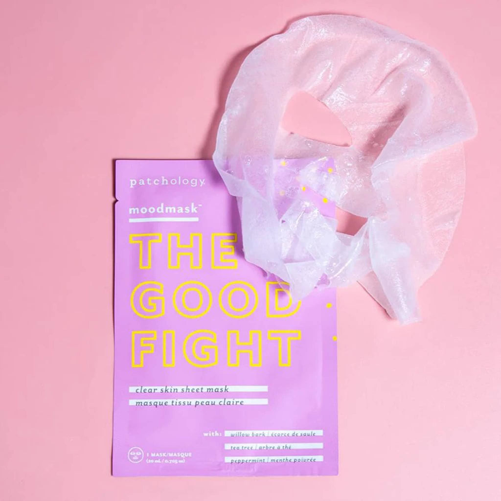 Patchology Moodmask The Good Fight Clear Skin Sheet Mask in pink pouch packaging with sheet mask laying over a corner of the pouch.