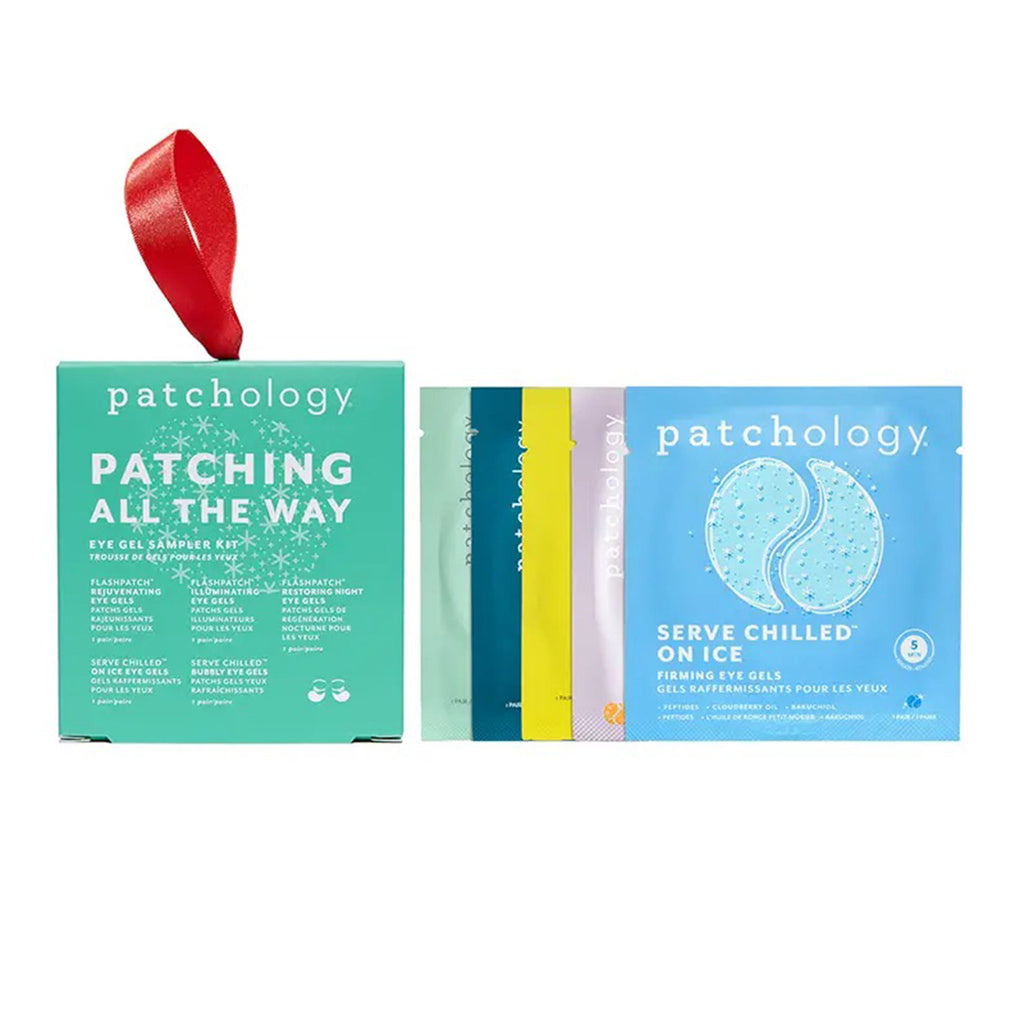Patchology Patching All the Way Eye Gel Sampler Kit front of green box packaging with red satin ribbon for hanging with contents stacked beside it.