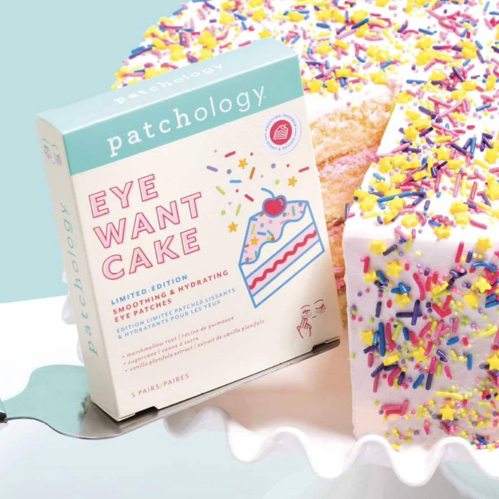 Patchology Eye Want Cake Limited Edition Smoothing & Hydrating Eye Patches in box packaging, shown on a cake server with cake.