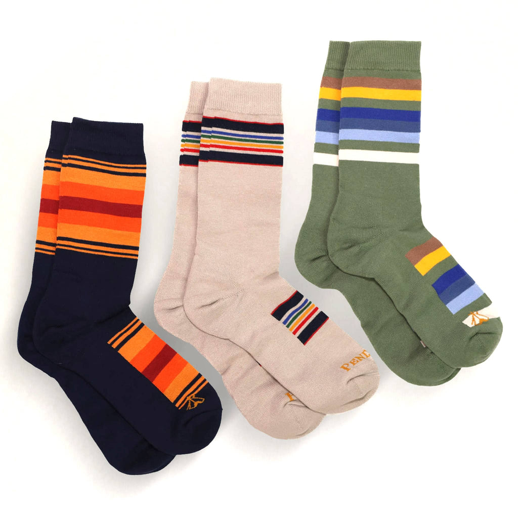 Three pairs of striped socks in different colors on a white background.