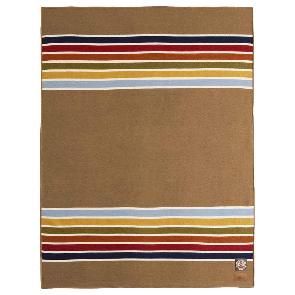 Camel brown blanket with multicolored stripes on a white background.