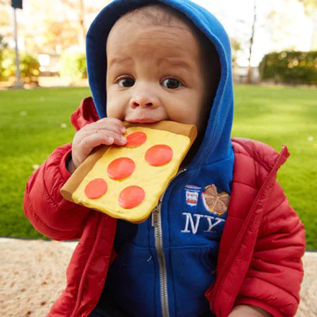 PiccoliNY Cameron's Corner Pepperoni Slice natural rubber baby teether toy, in childs mouth.