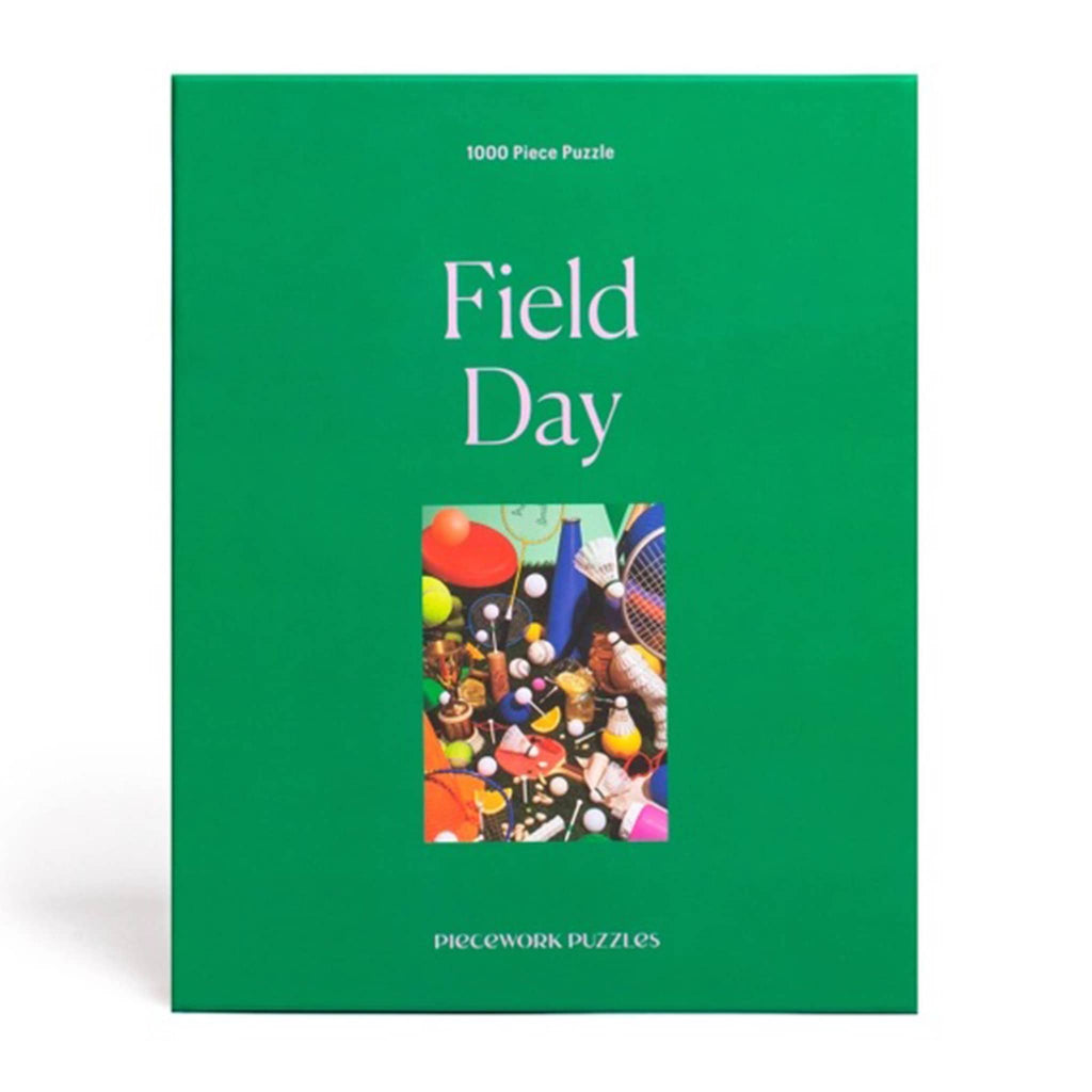 Piecework Puzzles 1000 Piece Field Day jigsaw puzzle in green box, front view.
