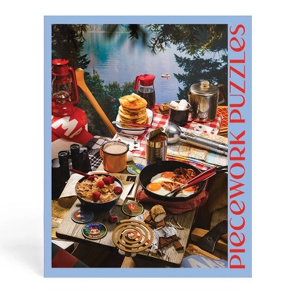 Puzzle box with a scenic camp setup featuring food and outdoor elements.