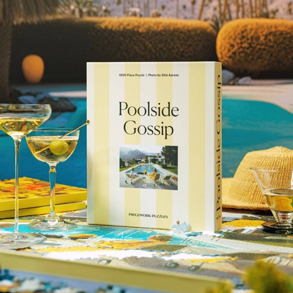 Piecework Puzzles 1000 piece Poolside Gossip jigsaw puzzle in box, with martini glasses and a pool in the background.