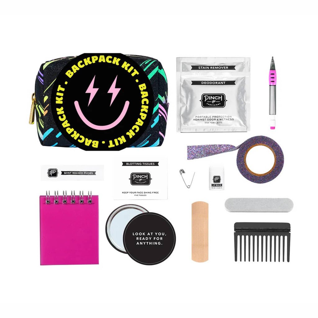 Backpack kit with various items including a smiley face pouch, bandages, and a mirror on a white background.
