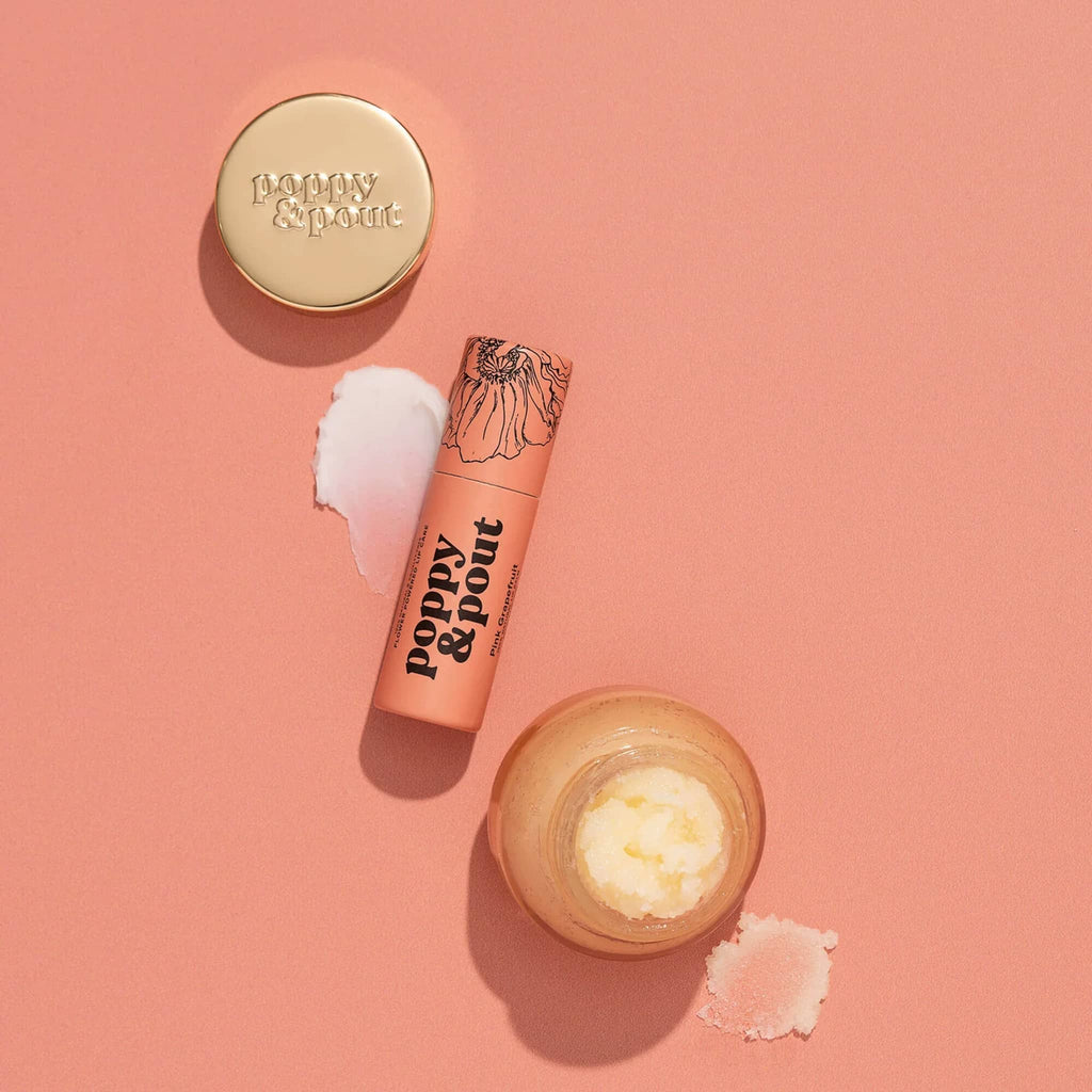 Poppy & Pout Pink Grapefruit Lip Care Duo, contents with product swipes on a coral backdrop.