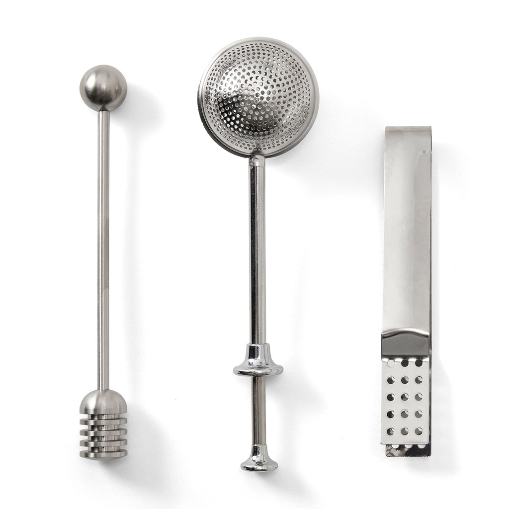 Printworks The Essentials Tea Tools for Tea Lovers, set of 3 stainless steel tools from left to right: honey dipper, tea infuser and tea tong.