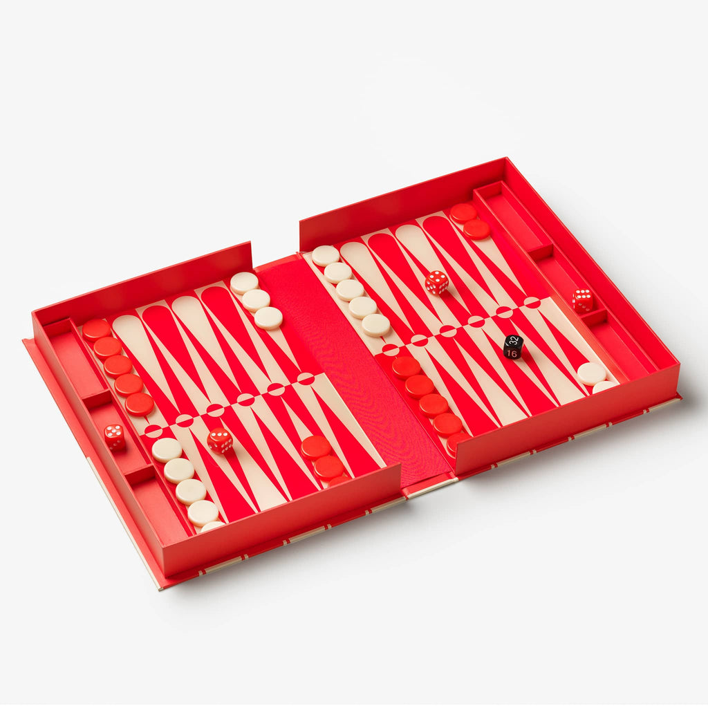 Backgammon set with red and cream pieces on a light gray background.