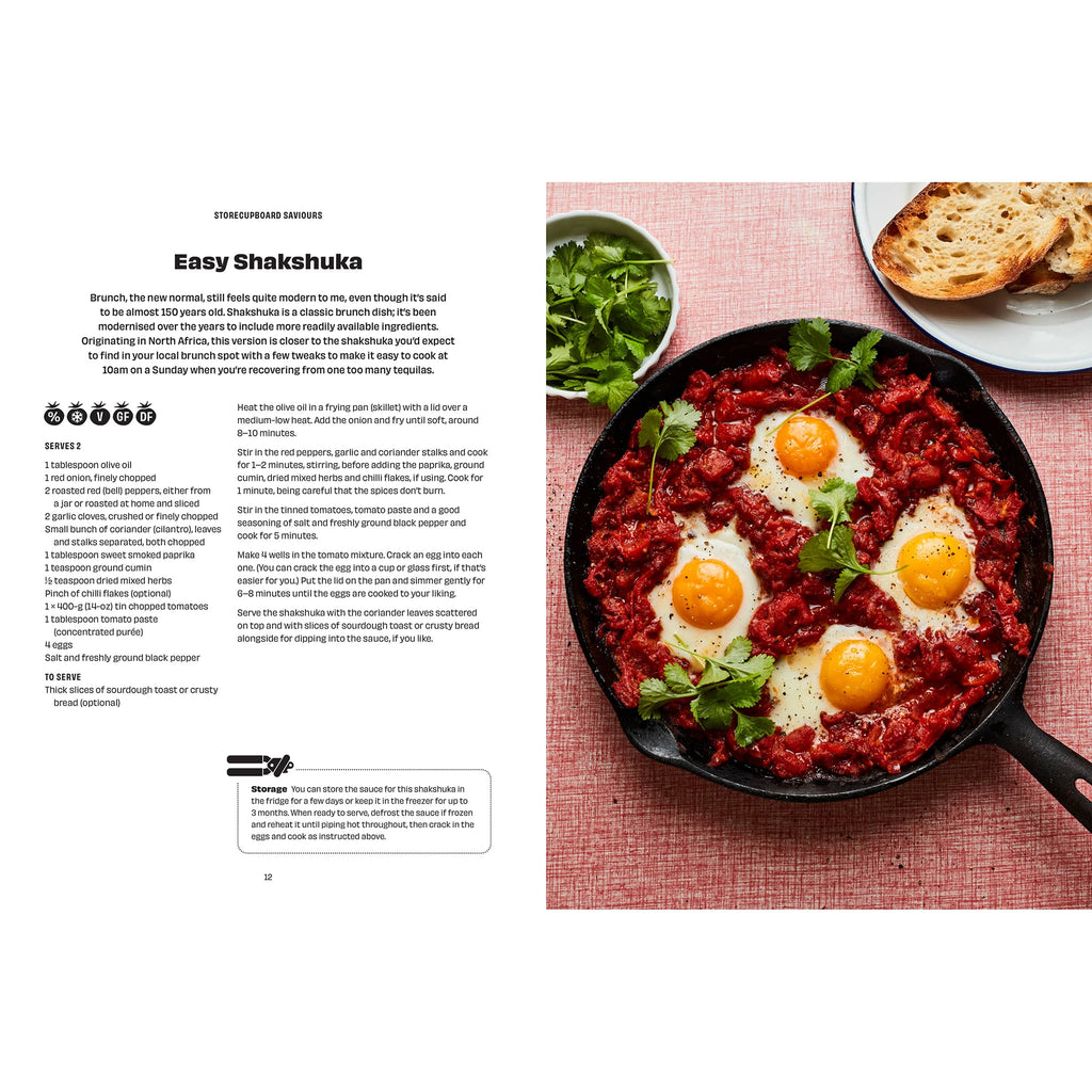 Cookbook page with Shakshuka recipe and dish on a pink tablecloth.