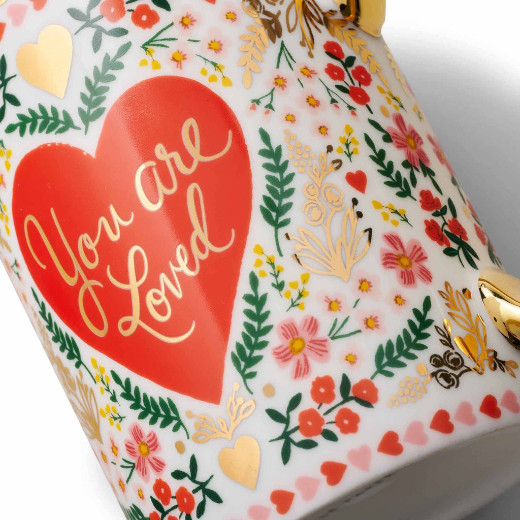 Rifle Paper Co. Juliet floral print porcelain mug with gold rim and handle, detail showing gold foil in design.