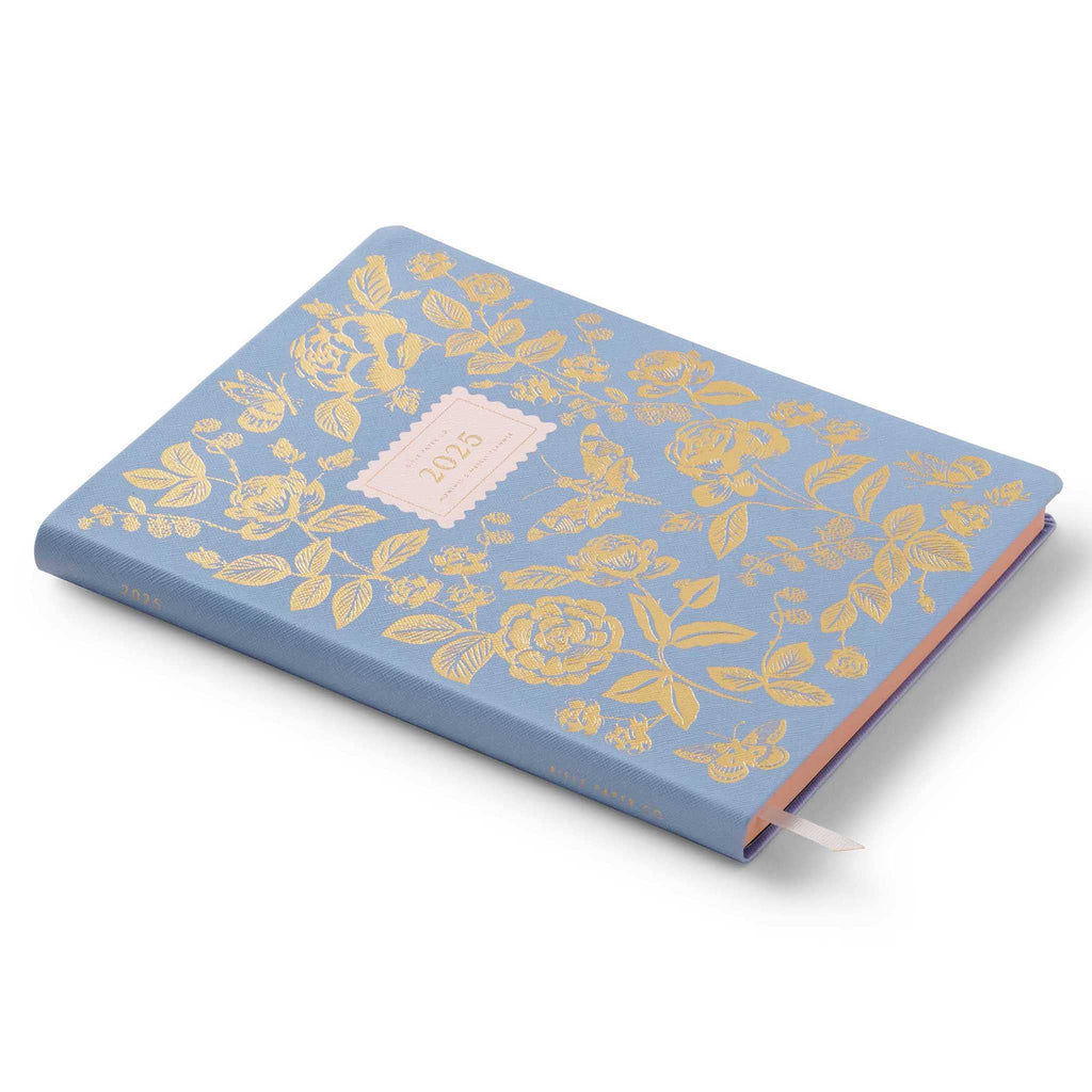 Rifle Paper Co. 2025 English Rose 12-Month Book-bound planner, front cover, shown from side angle view.