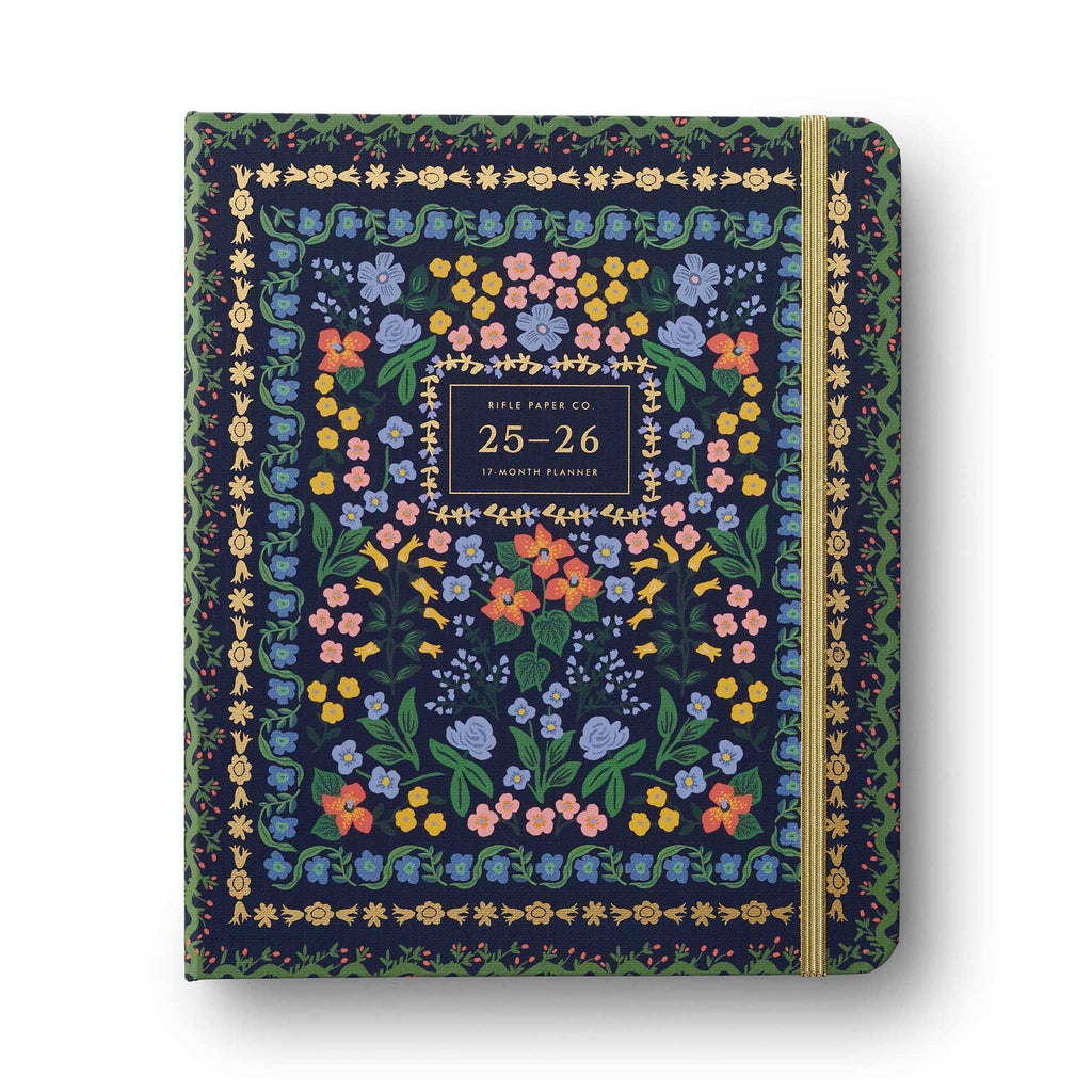 Rifle Paper Co. Wildwood 2025-2026 Academic Planner, floral print cover with gold elastic band, on white background.