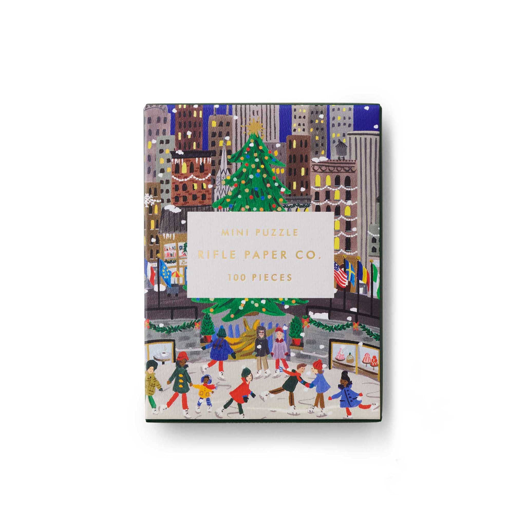 Rifle Paper Co. 100 Piece Holiday on Ice mini jigsaw puzzle in box packaging, front view.