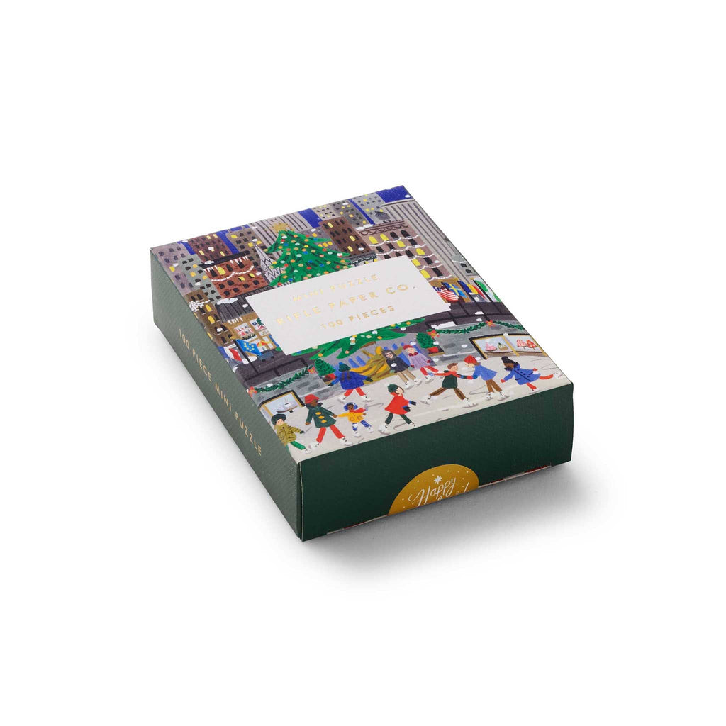 Rifle Paper Co. 100 Piece Holiday on Ice mini jigsaw puzzle in box packaging, front angle view.