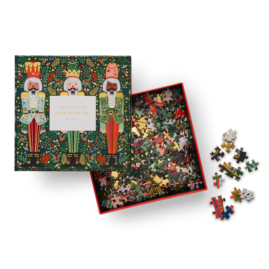 Rifle Paper Co 500 Piece Nutcracker Brigade jigsaw puzzle in box packaging, front view with lid off.