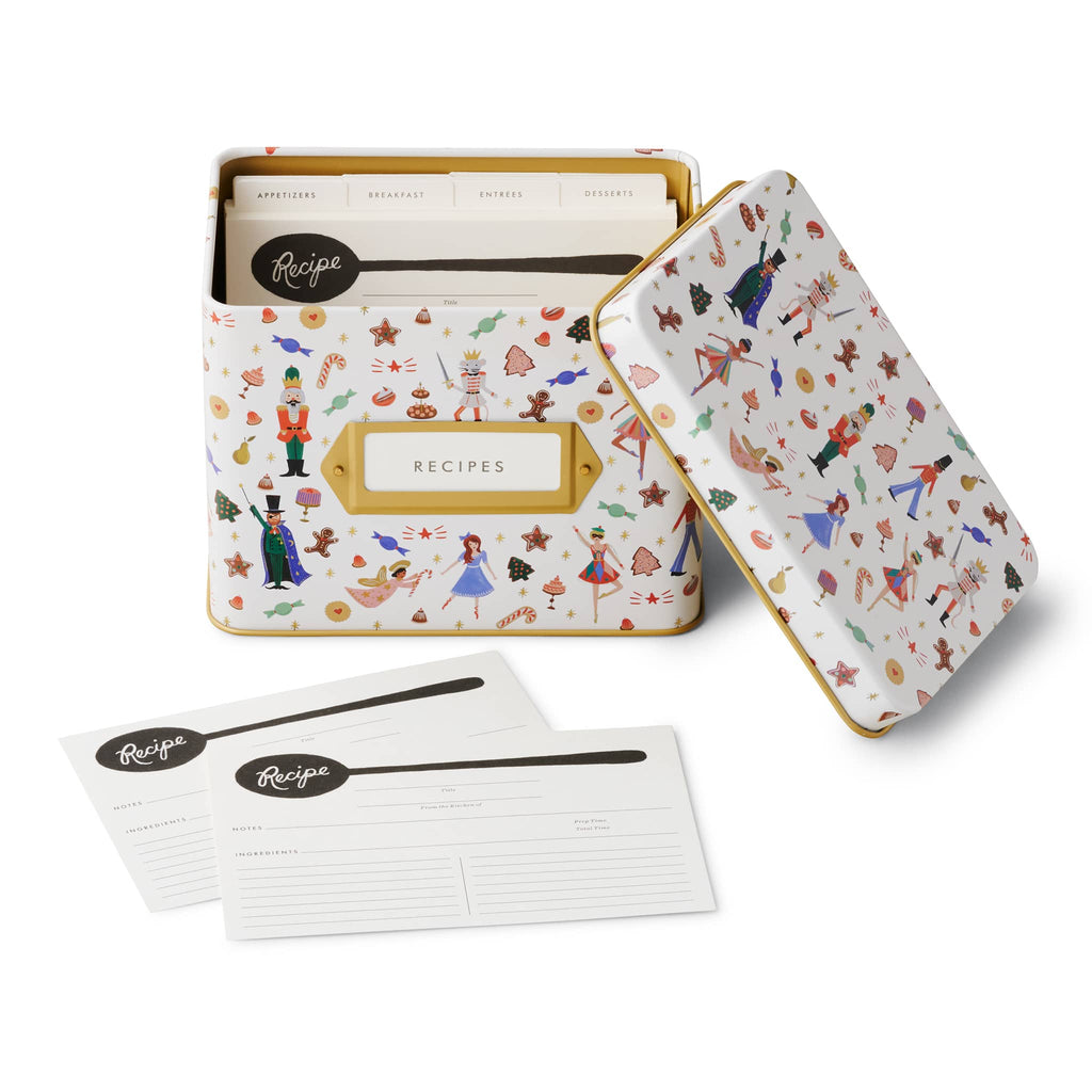 Holiday patterned recipe box with recipe cards on a white background.