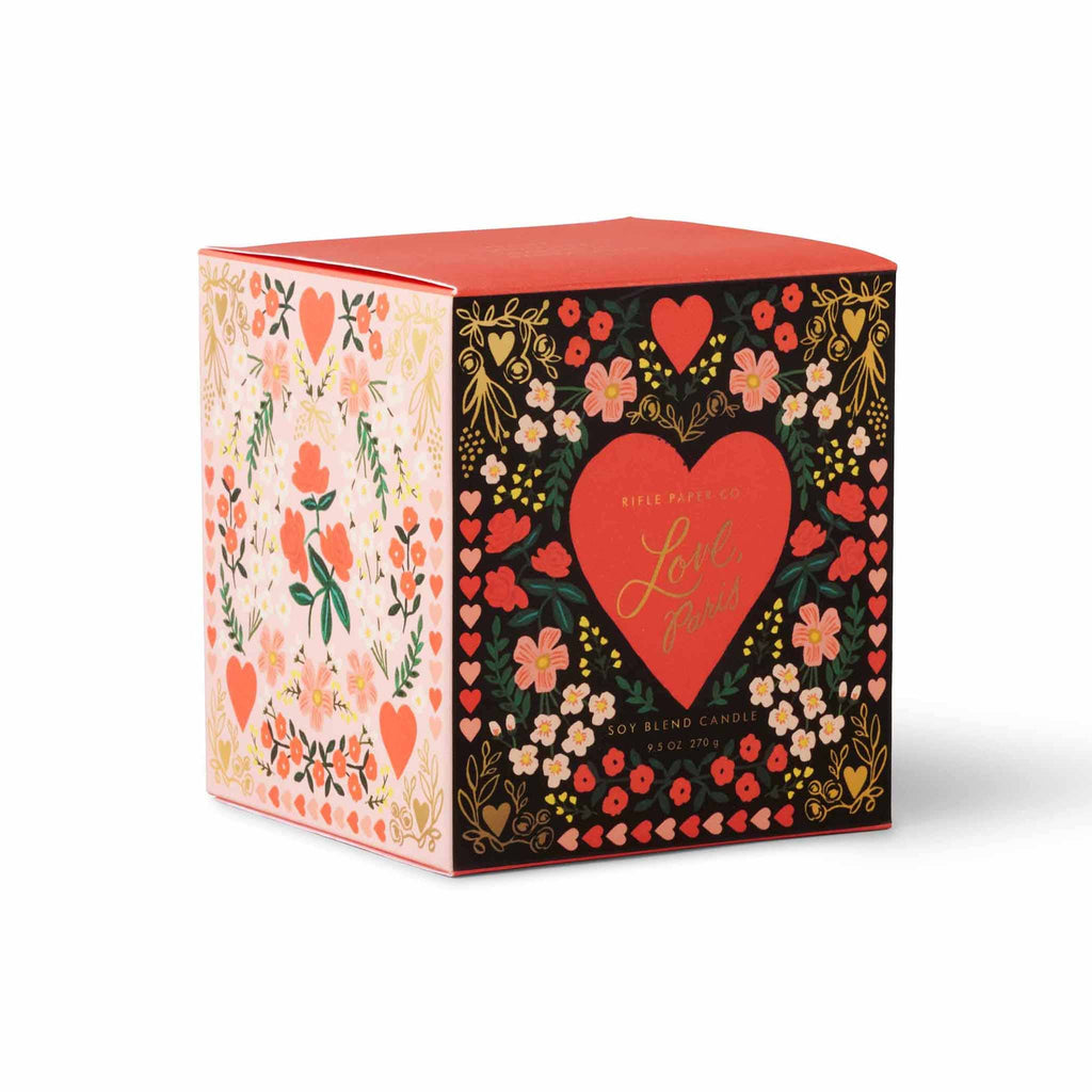 Rifle Paper Co. Love, Paris scented 9.5 ounce soy wax candle in floral illustrated gift box, front angle view.