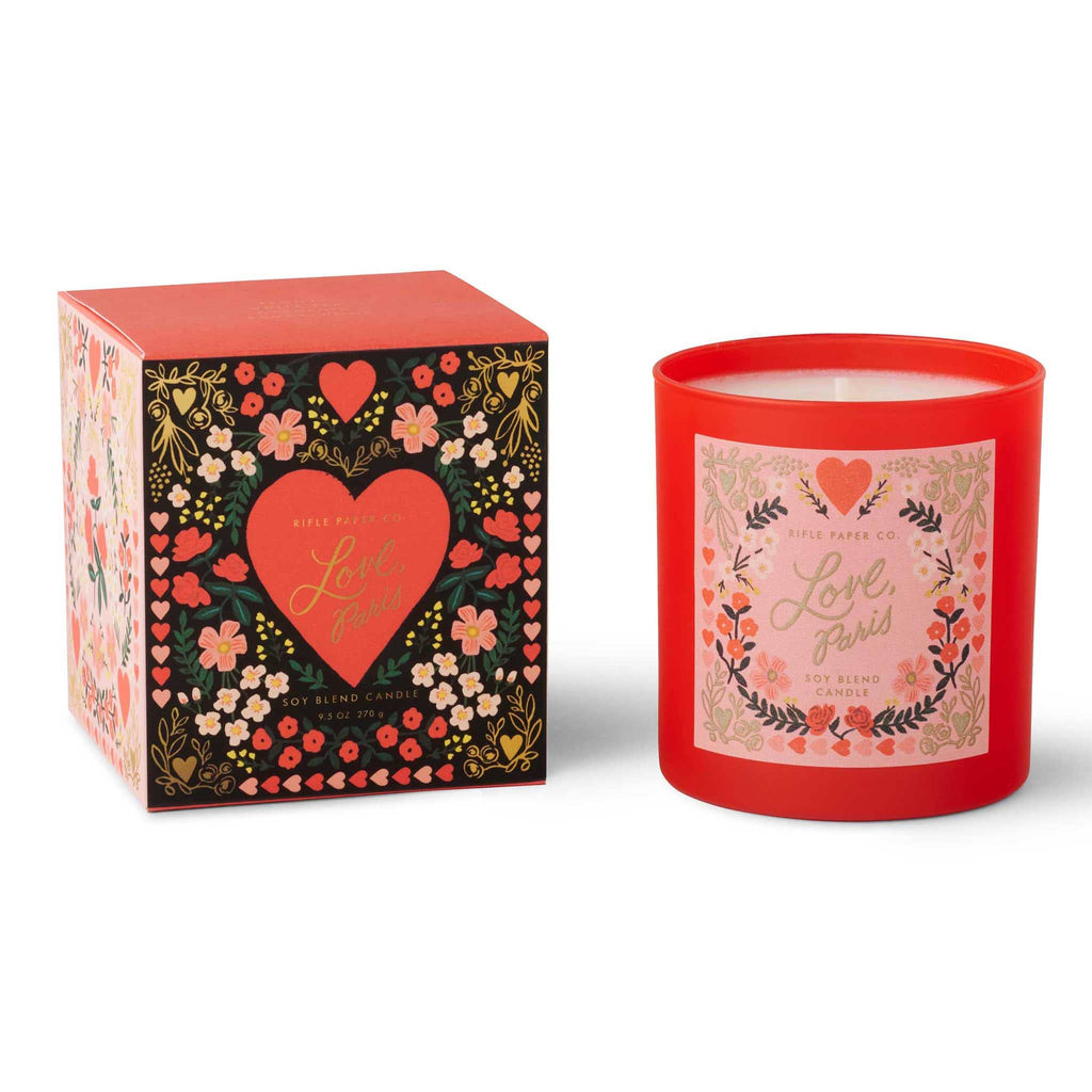 Rifle Paper Co. Love, Paris scented 9.5 ounce soy wax candle in red painted glass vessel and illustrated label with matching gift box.