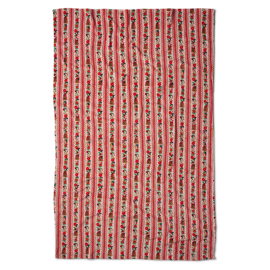 Full view of a red and pink festive fleece blanket, on a white background.