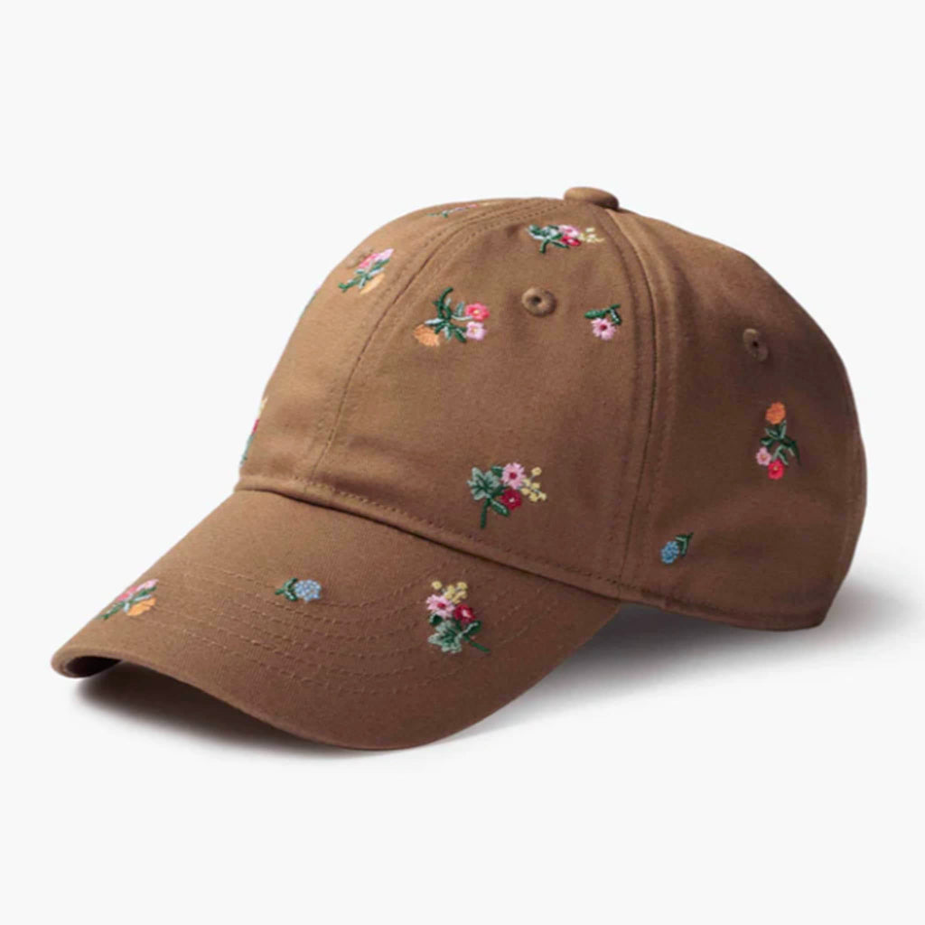 Brown cap with floral embroidery on a white background.