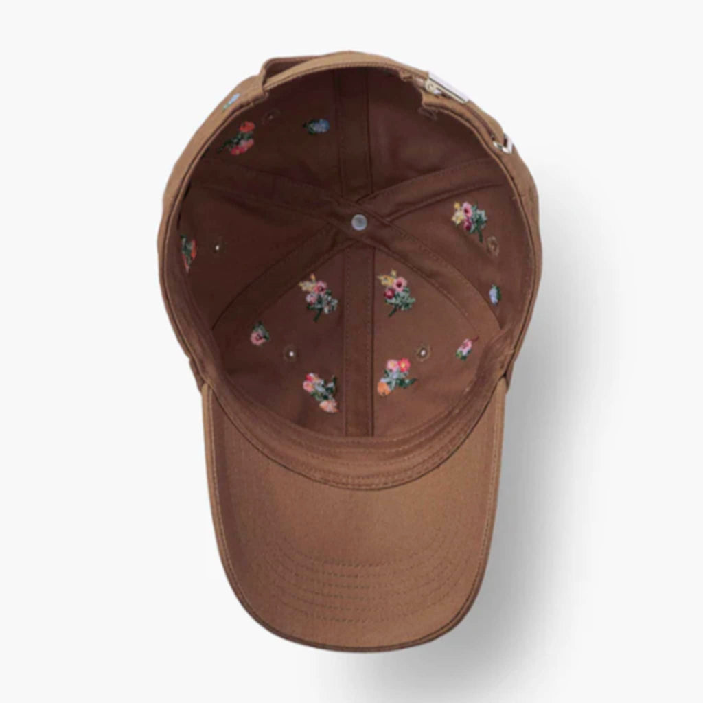 Brown cap with floral embroidery, upside down to show interior detail, on a white background.