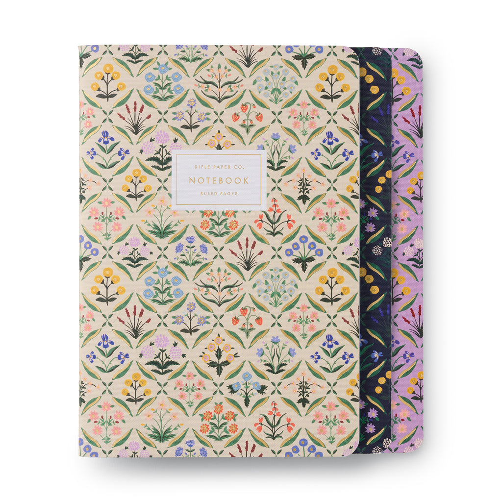 Rifle Paper Co. Estee Stitched Notebook Set of 3, stacked view of floral front covers in cream, navy and violet.