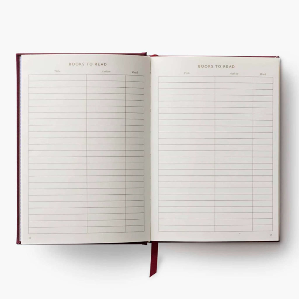 Open notebook with 'Books to Read' list on a white background.