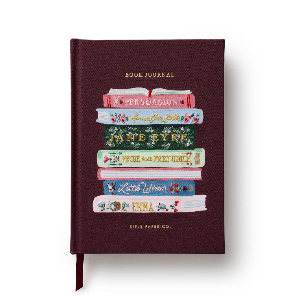 Book Journal with fabric cover and illustrated book spines with embroidery detail on a white background.
