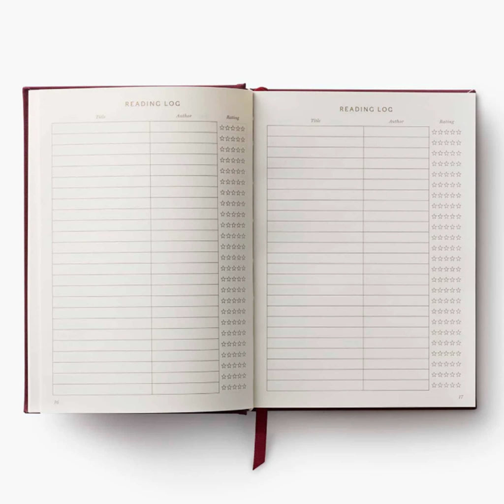 Open notebook with a reading log on a white background.
