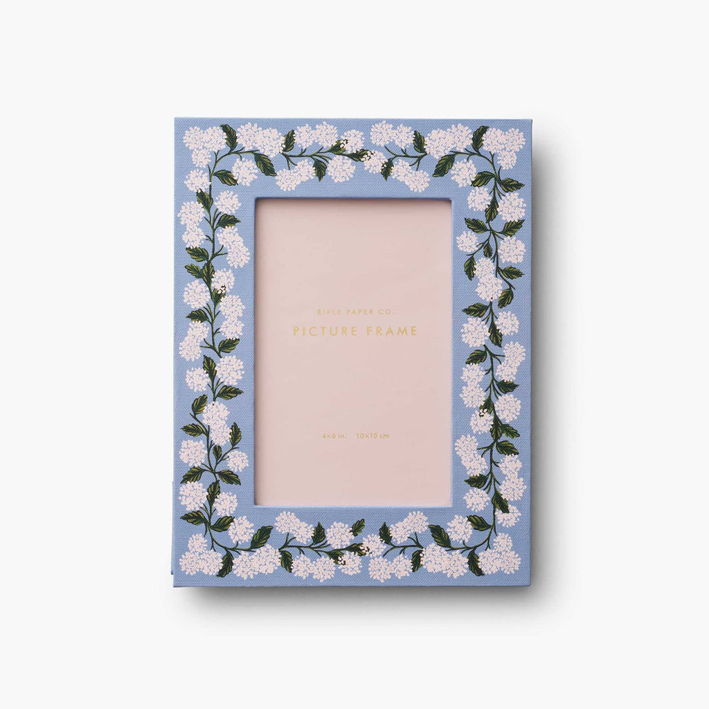 Rifle Paper Co. Hydrangea print paper-wrapped picture frame holds a 4x6 inch print, front view.