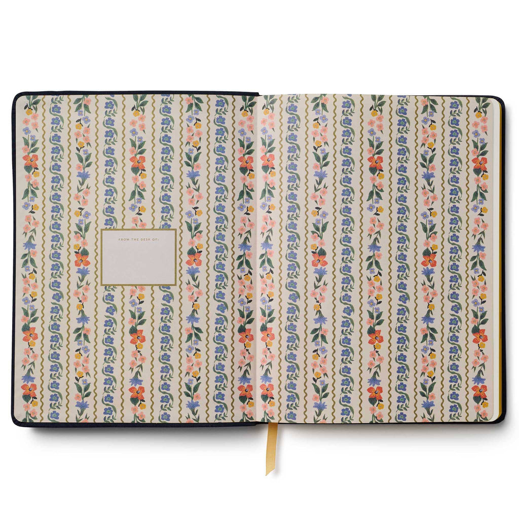 Rifle Paper Co. Wildwood 2026 12-month embroidered book bound planner, inside front cover with floral print, on white background.