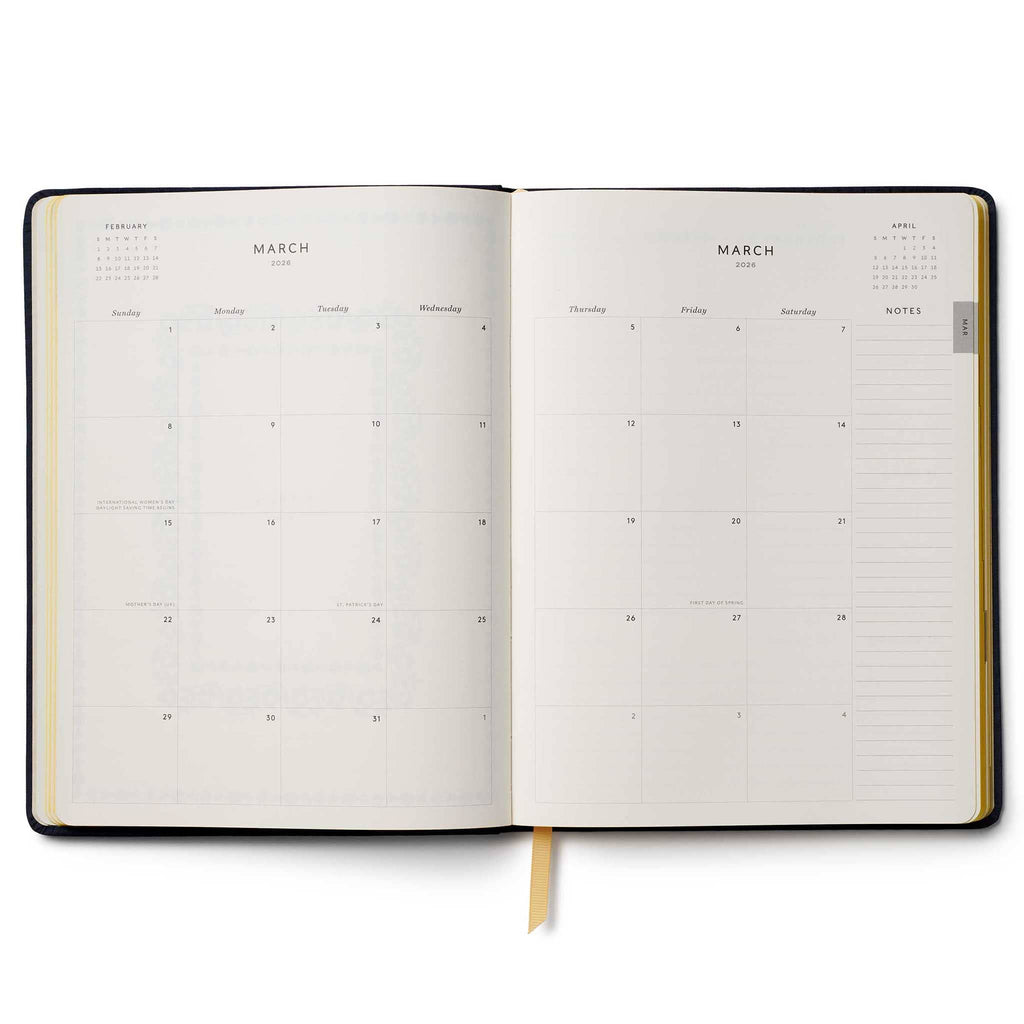 Rifle Paper Co. Wildwood 2026 12-month floral embroidered book bound planner, monthly view, on a white background.