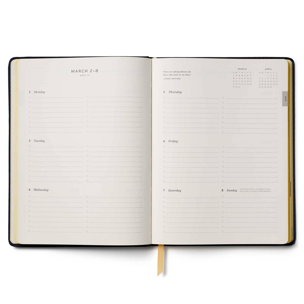 Rifle Paper Co. Wildwood 2026 12-month floral embroidered book bound planner, weekly view, on a white background.