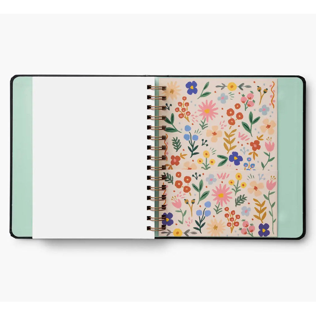 Floral print paper pocket inside the back cover of the Rifle Paper Co. Flores 2024 17-Month Planner.