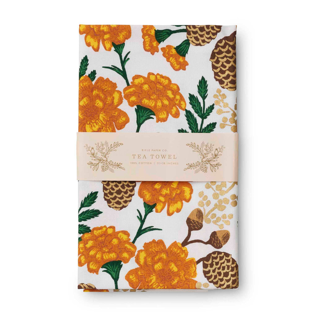 Rifle Paper Co. Grateful Harvest printed cotton tea towel, folded in belly band packaging.