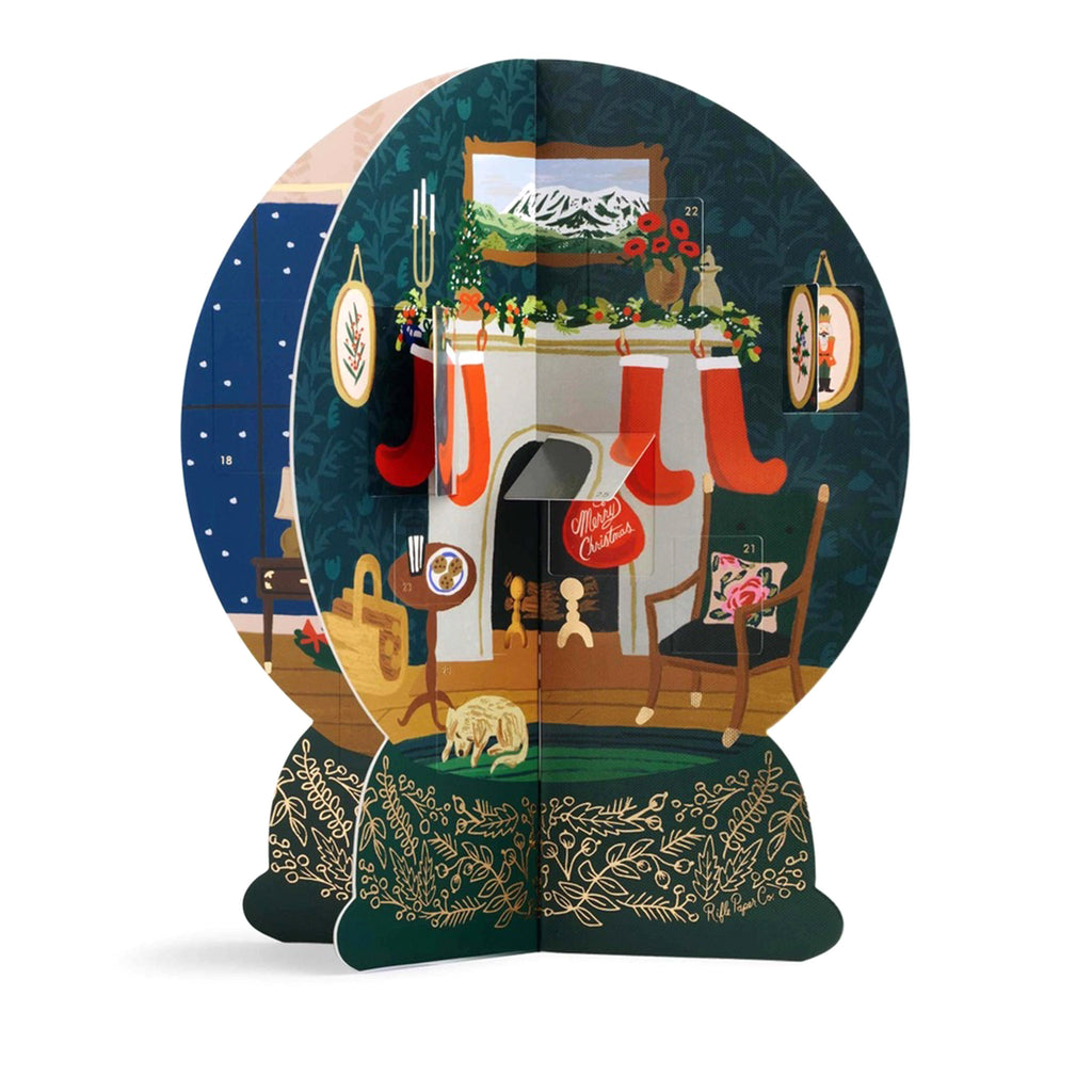 Rifle Paper Co. Paper Snow Globe Advent Calendar, 4-sided 3d construction, fireplace view.