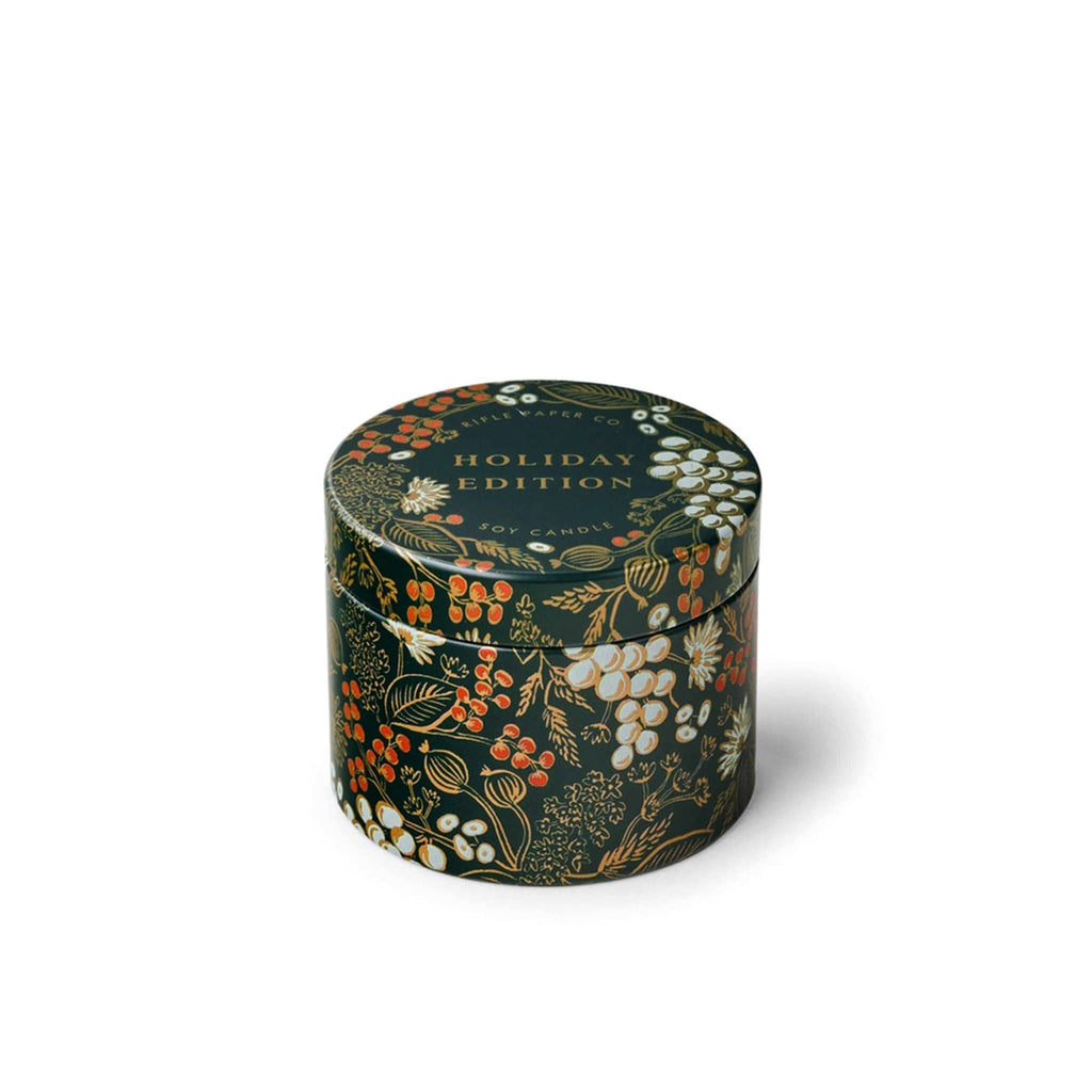 Rifle Paper Co. Holiday Edition scented soy wax candle in dark green illustrated tin with lid.