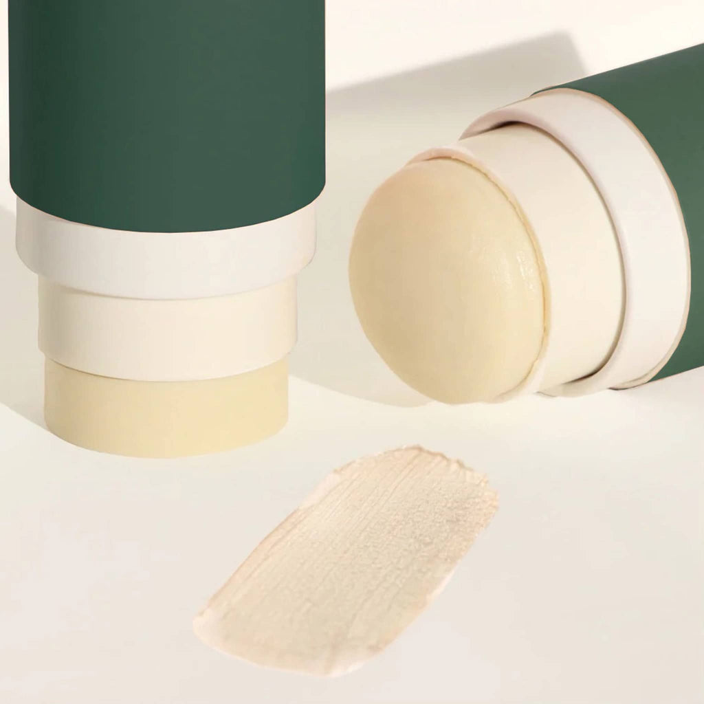 Routine Like A Boss Natural Deodorant Stick in hunter green cardboard tube packaging, lid off with smear.