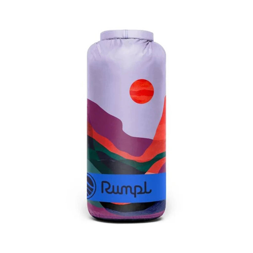 Rumpl Valley Dusk original puffy blanket with an abstract colorful design, rolled up in matching stuff sack carrier, on a white background.