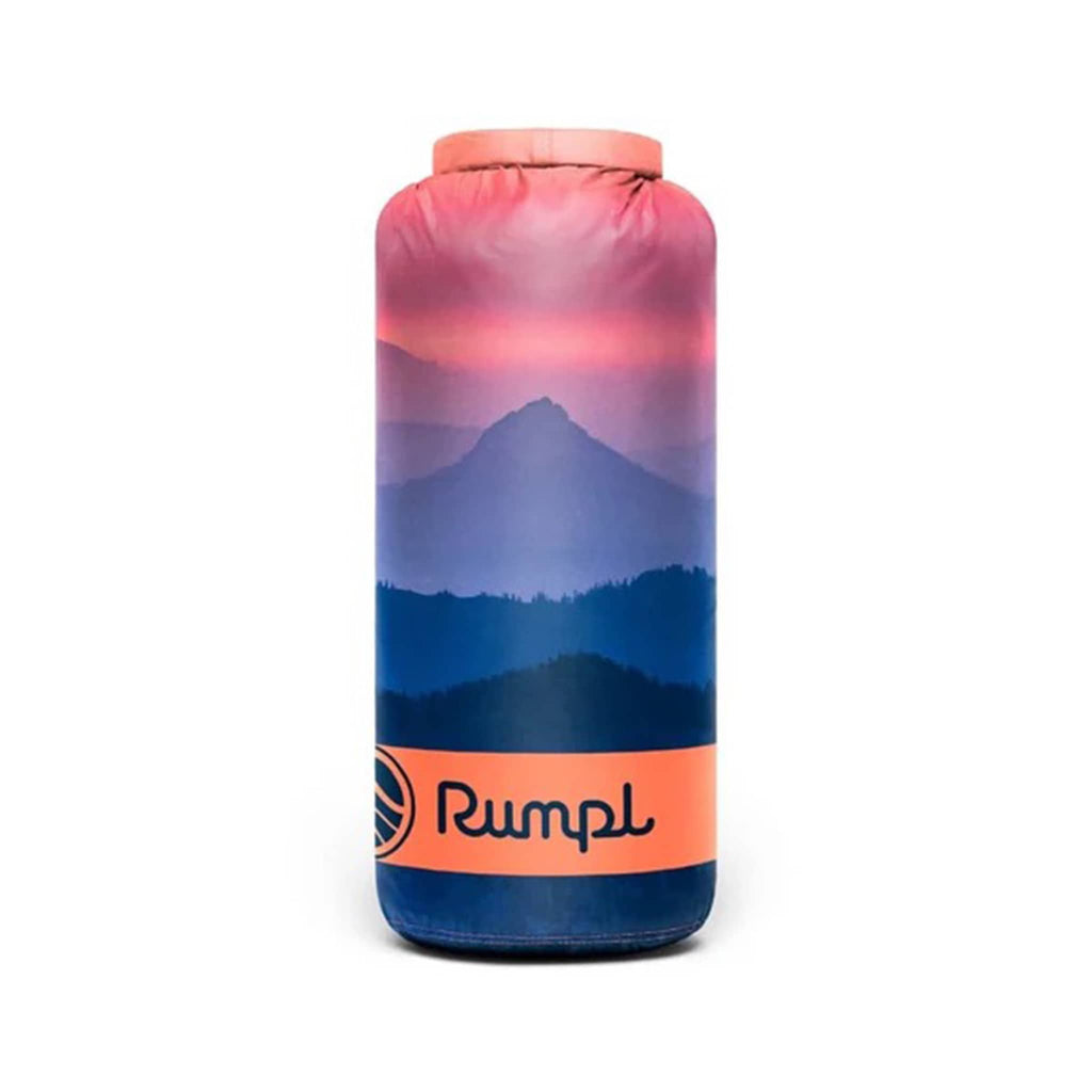 Rumpl Alpenglow original puffy blanket with mountain sunrise image in blue and orange, rolled up in matching stuff sack carrier.