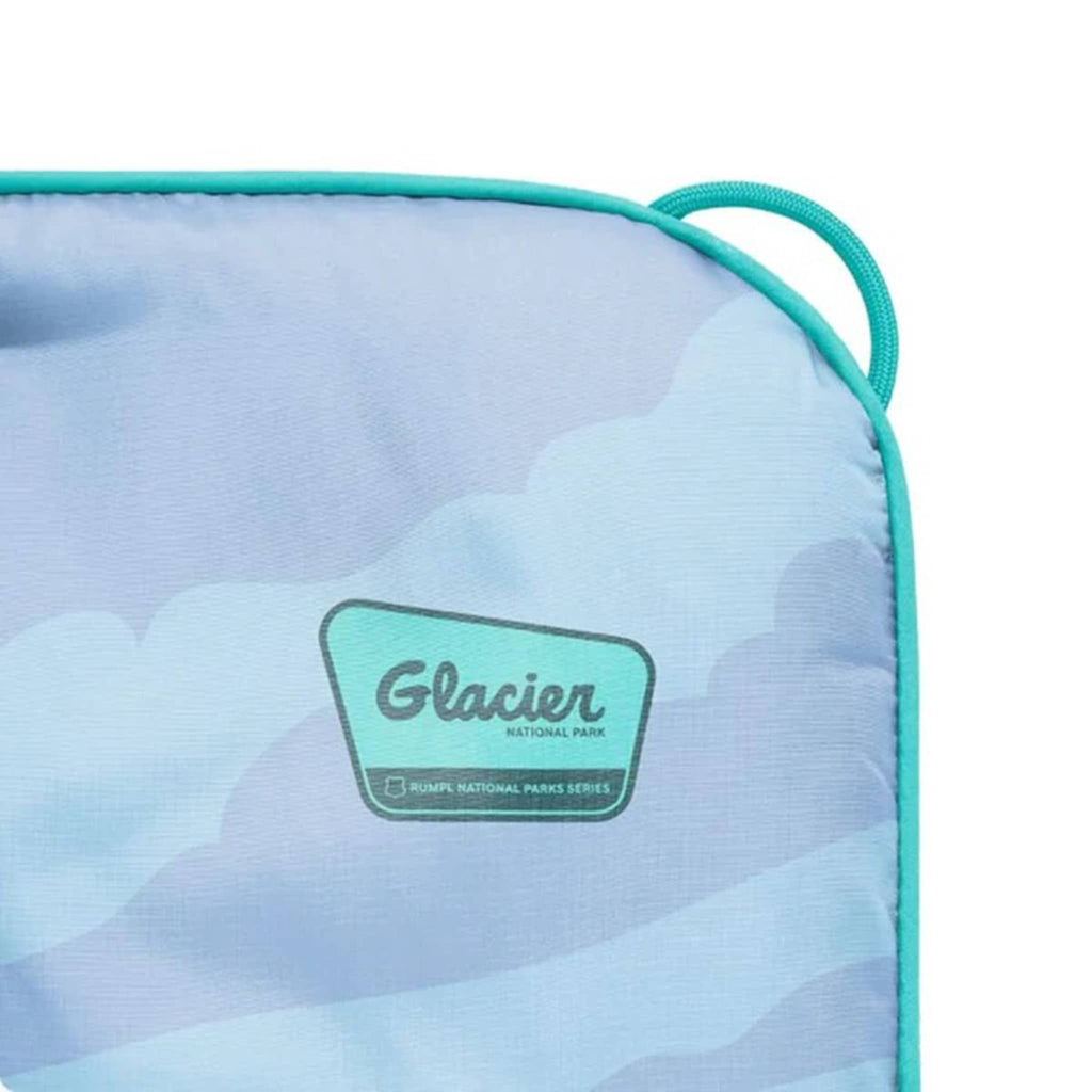 Corner puffy blanket detail with a 'Glacier National Park' logo on a white background.