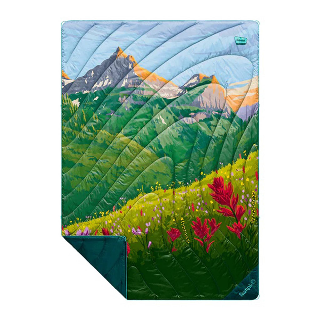 Rumpl Glacier National Park original puffy blanket with a scenic design of mountains and flowers, flat with corner folded back, on a white background.